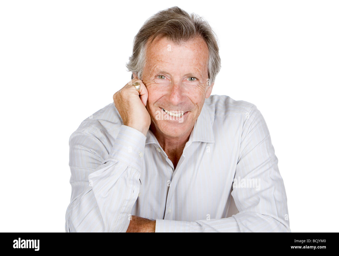 Isolated Shot of a Happy Senior Gentleman Sitting Down Stock Photo