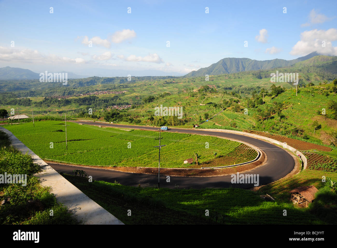 Van Taking A Hairpin Turn In An Indonesian Landscape Stock Photo
