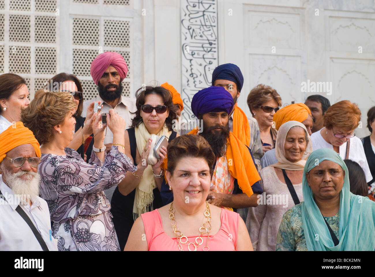 Multinational crowd at the Taj Mahal palace. Stock Photo