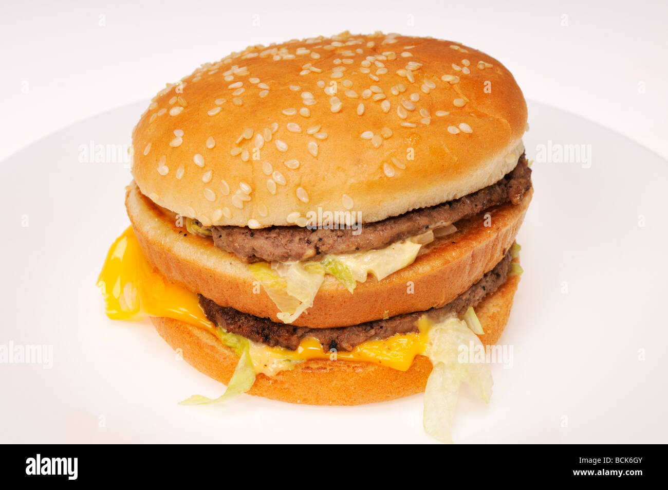Mcdonalds Big Mac on white plate on white background. Stock Photo