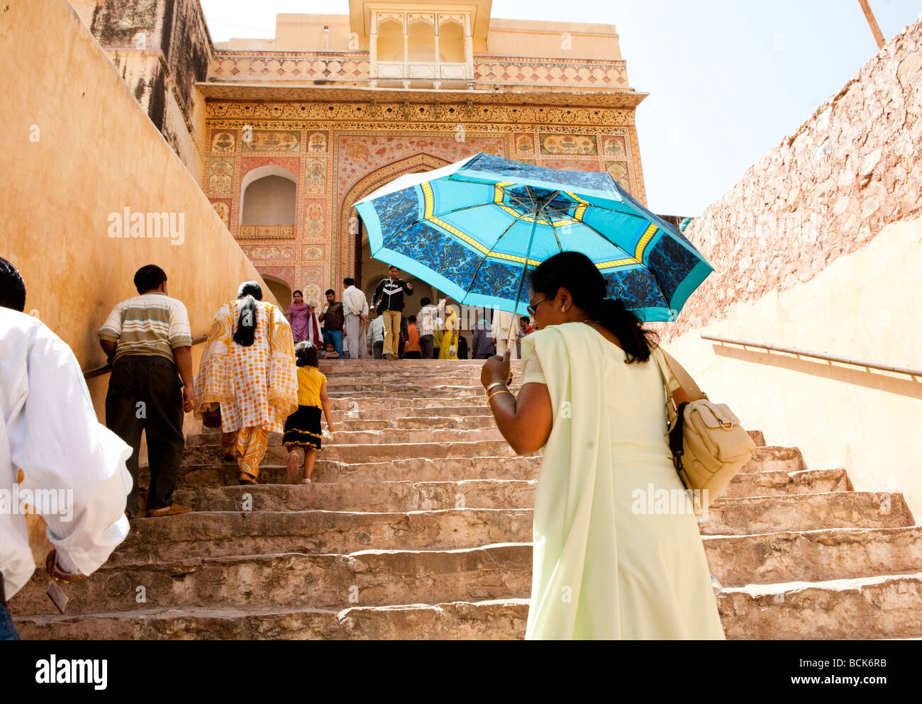 Indian Women With Umbrella On The Steps Of The Amber Fort  Jaipur Rajasthan India Stock Photo