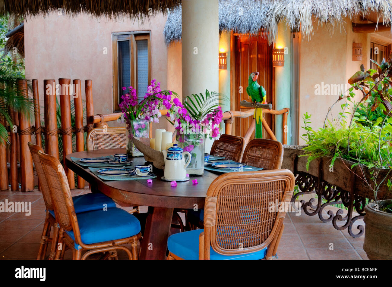 Interior view of dining area under a palapa roof in a tropical home located in Nayarit, Mexico. Stock Photo
