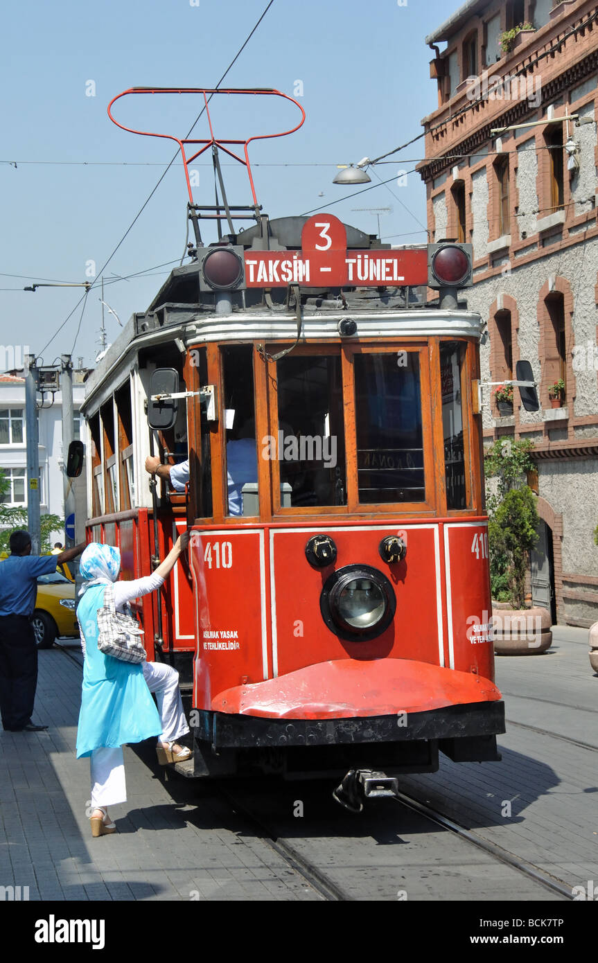A woman boarding the Antique Tram which runs between Tunel and Taksim Square in Istanbul Stock Photo