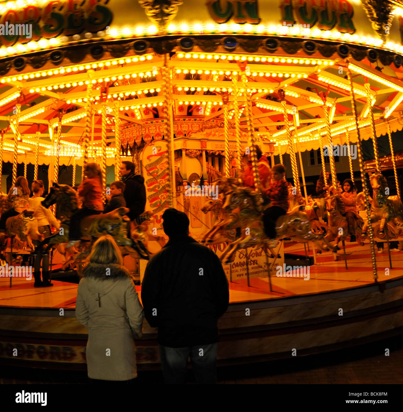 Illuminated carousel fairground ride in Abingdon Michaelmas Fair England Stock Photo