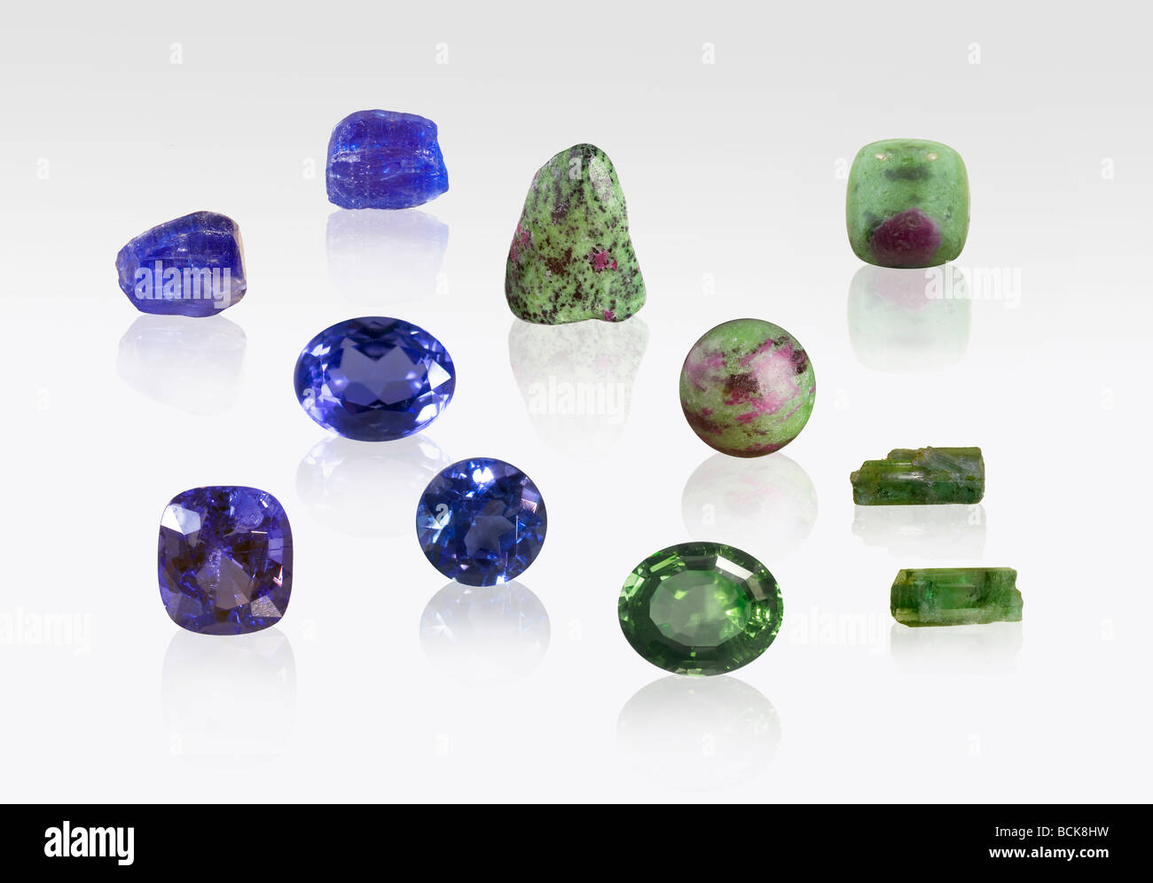 Zoisite gemstone and mineral specimens on white background Stock Photo