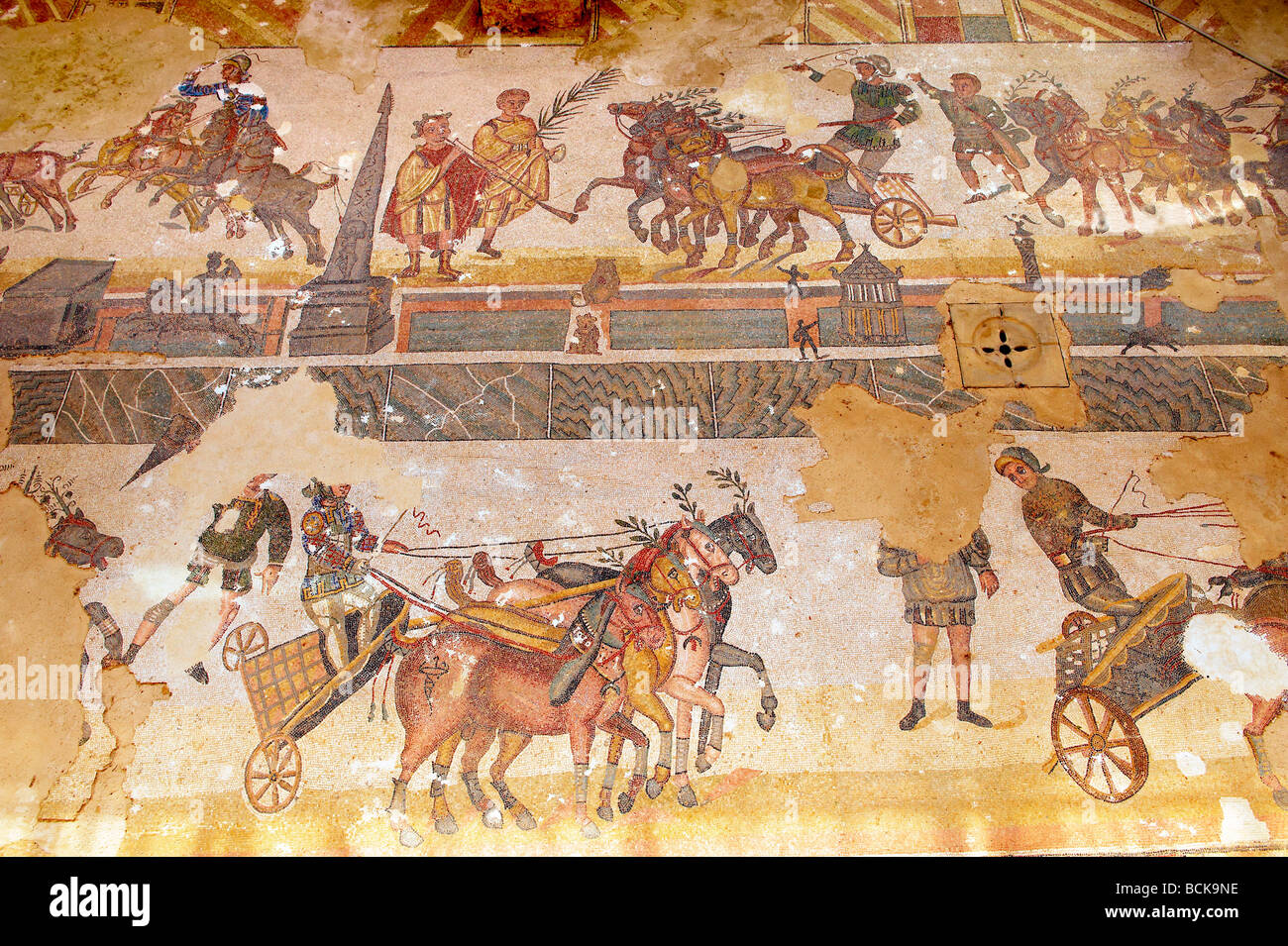 Roman mosaic of the hippodrome race  at the Villa Romana or Ericulia  or Casale Dei Saraceni, Morgantina, Sicily Stock Photo