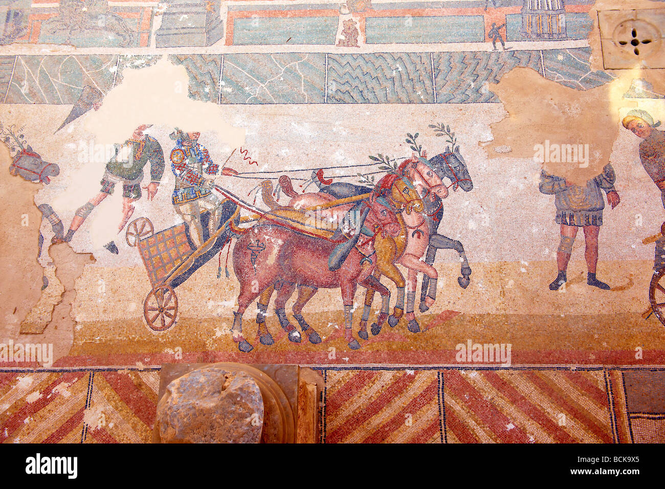 Roman mosaic of a race at the hippodrome at the Villa Romana or Ericulia  or Casale Dei Saraceni, Morgantina, Sicily Stock Photo