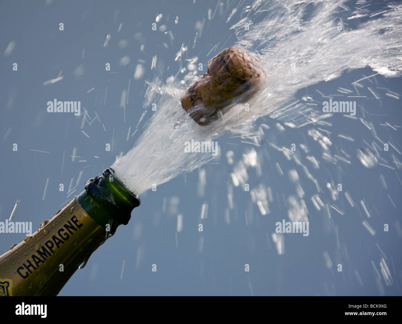 popping cork of an open champagne bottle Stock Photo Alamy