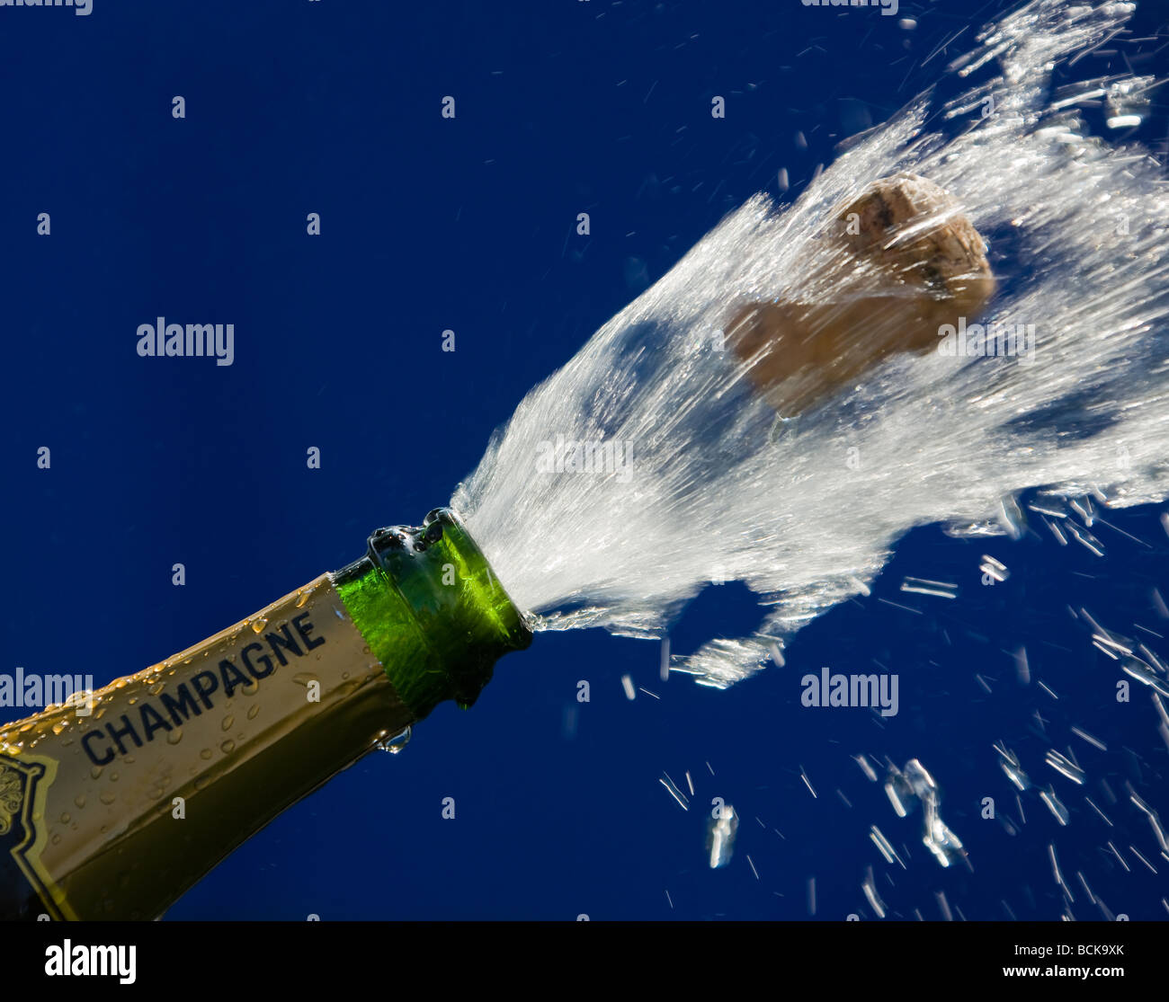 popping cork of an open champagne bottle Stock Photo Alamy