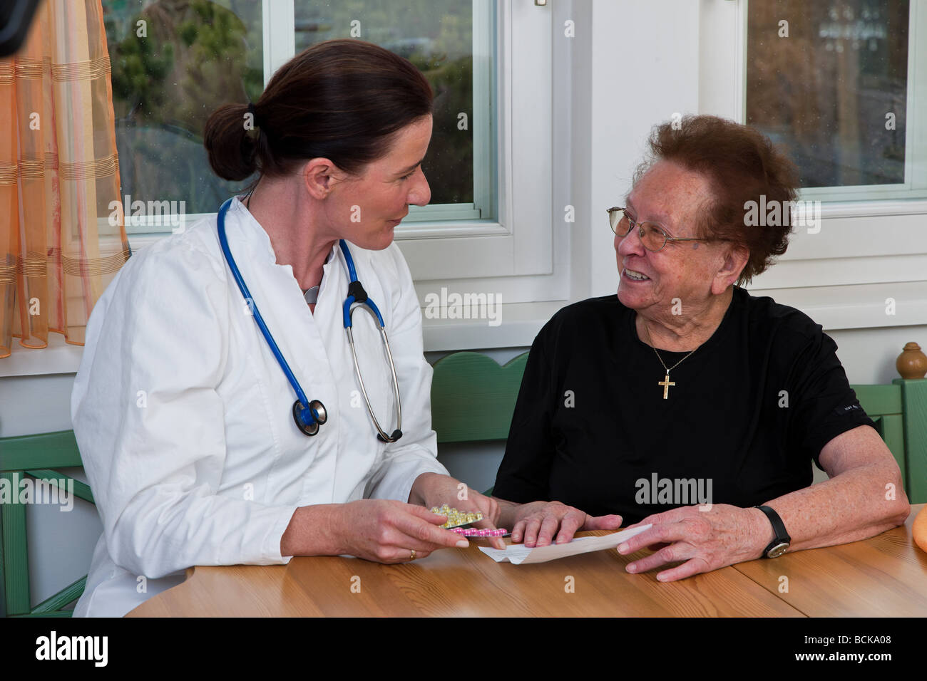 Doctor and patient discussing medication Stock Photo