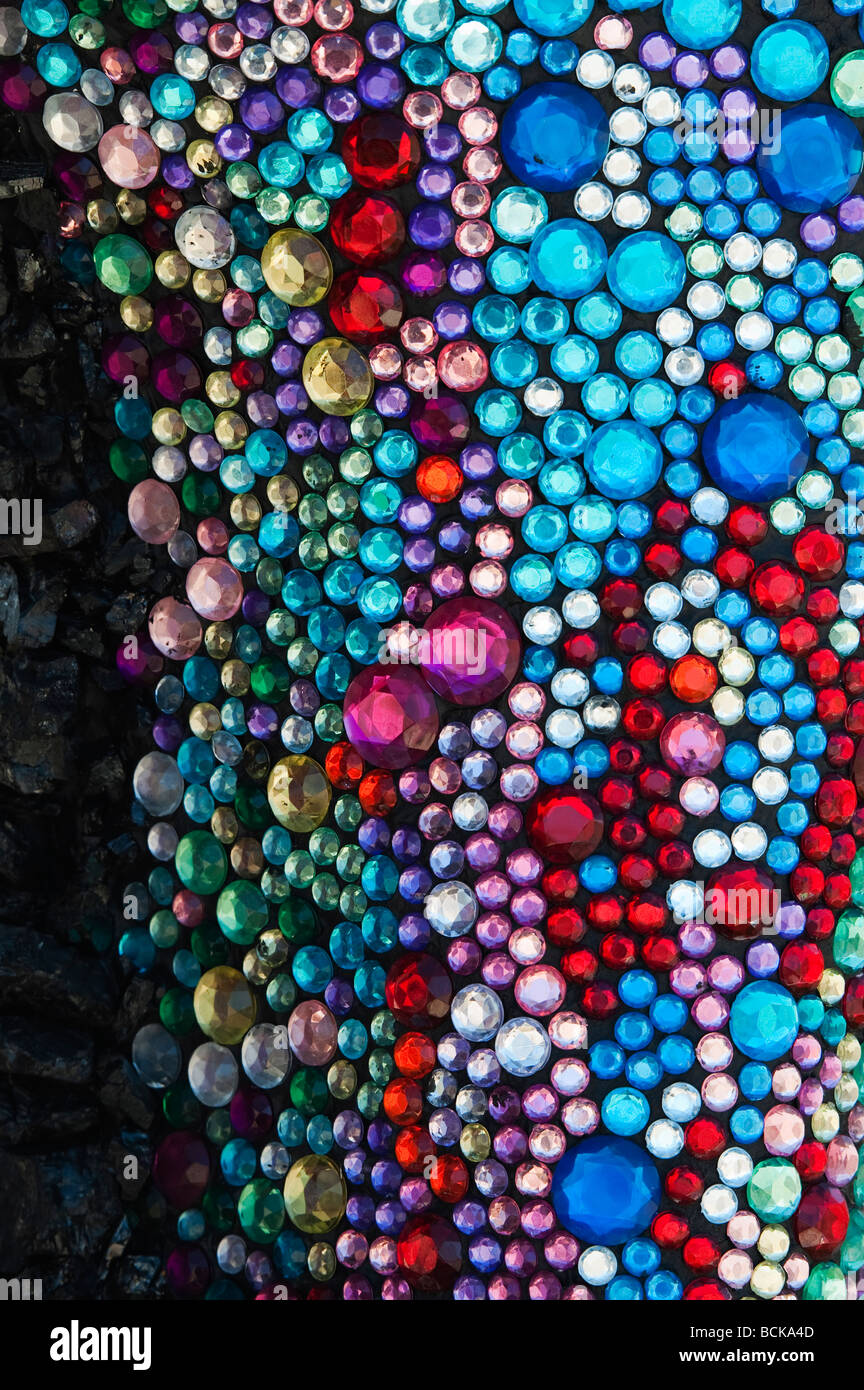 Coloured glass gems on a designed garden sculpture, England Stock Photo
