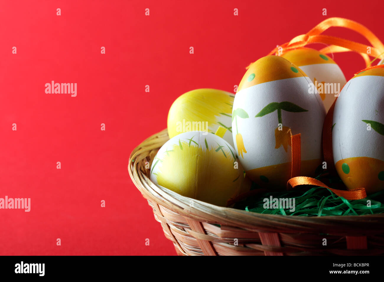 Painted easter eggs in basket Stock Photo - Alamy