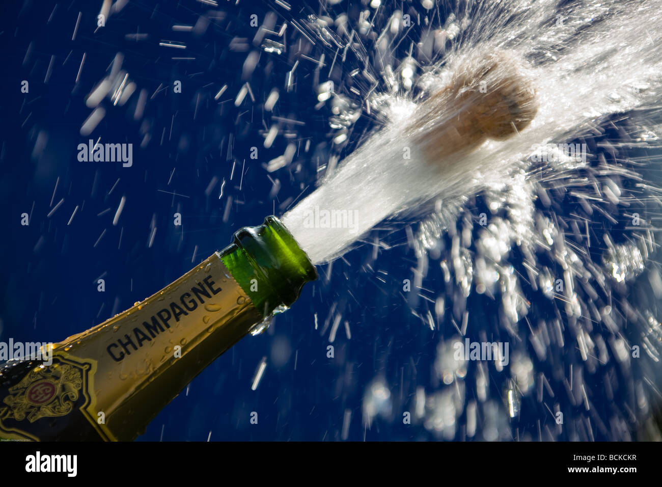 popping cork of an open champagne bottle Stock Photo Alamy
