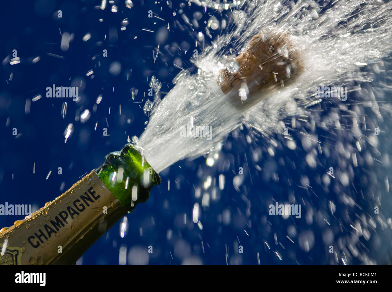popping cork of an open champagne bottle Stock Photo Alamy