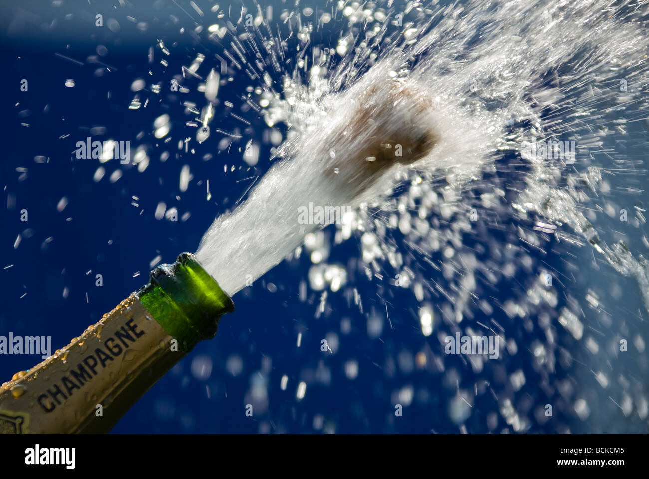 popping cork of an open champagne bottle Stock Photo Alamy