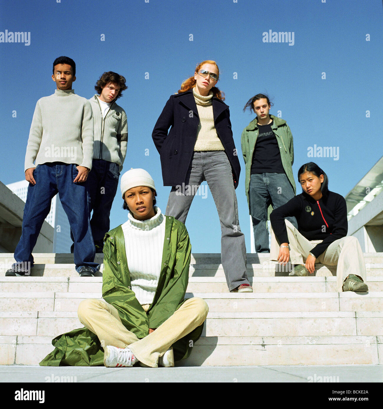 Urban scene, young people sitting on steps Stock Photo