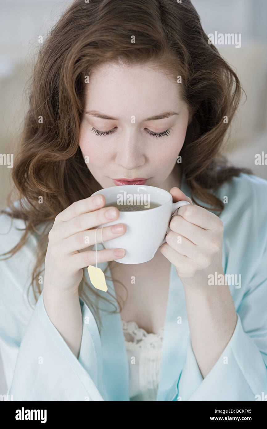 Woman having herbal tea Stock Photo
