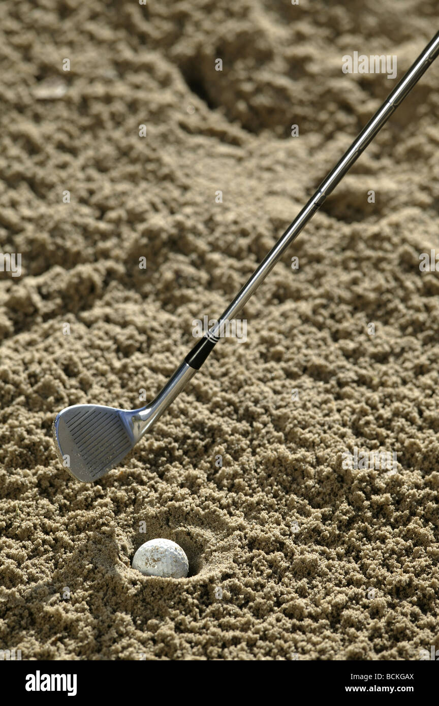 A Golf Ball plugged in a Sand Bunker Stock Photo Alamy