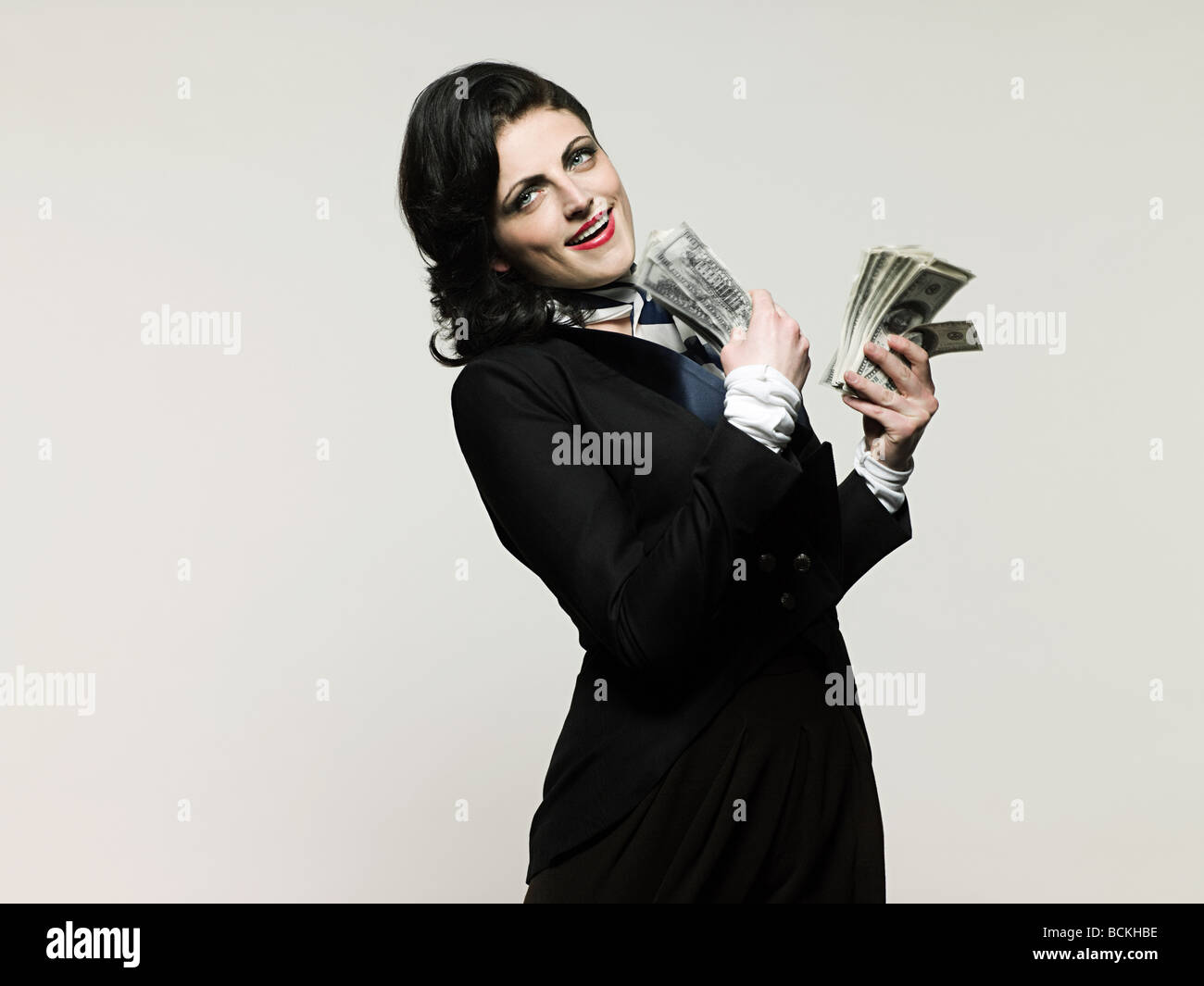 Businesswoman holding money Stock Photo