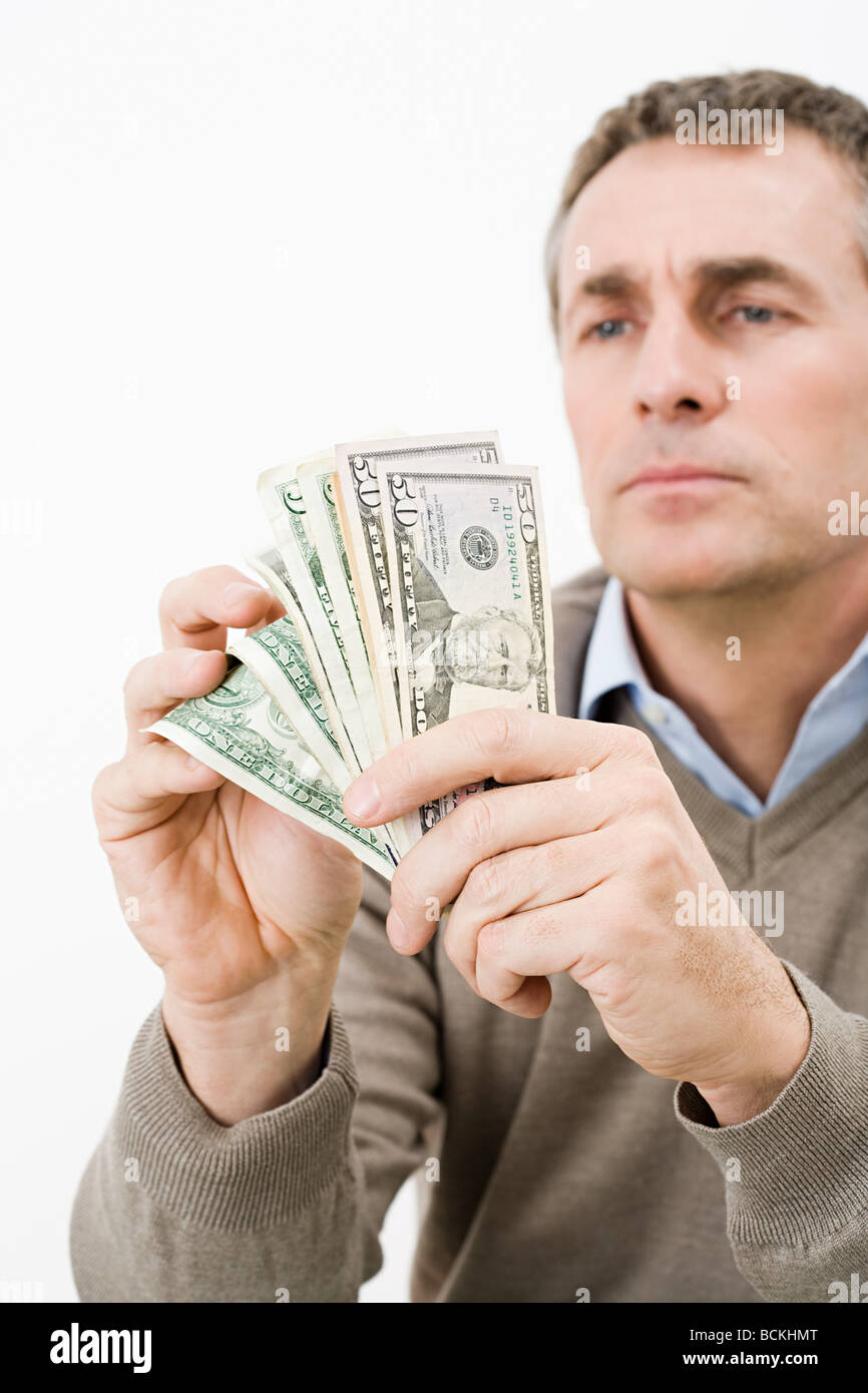 Man holding money Stock Photo Alamy