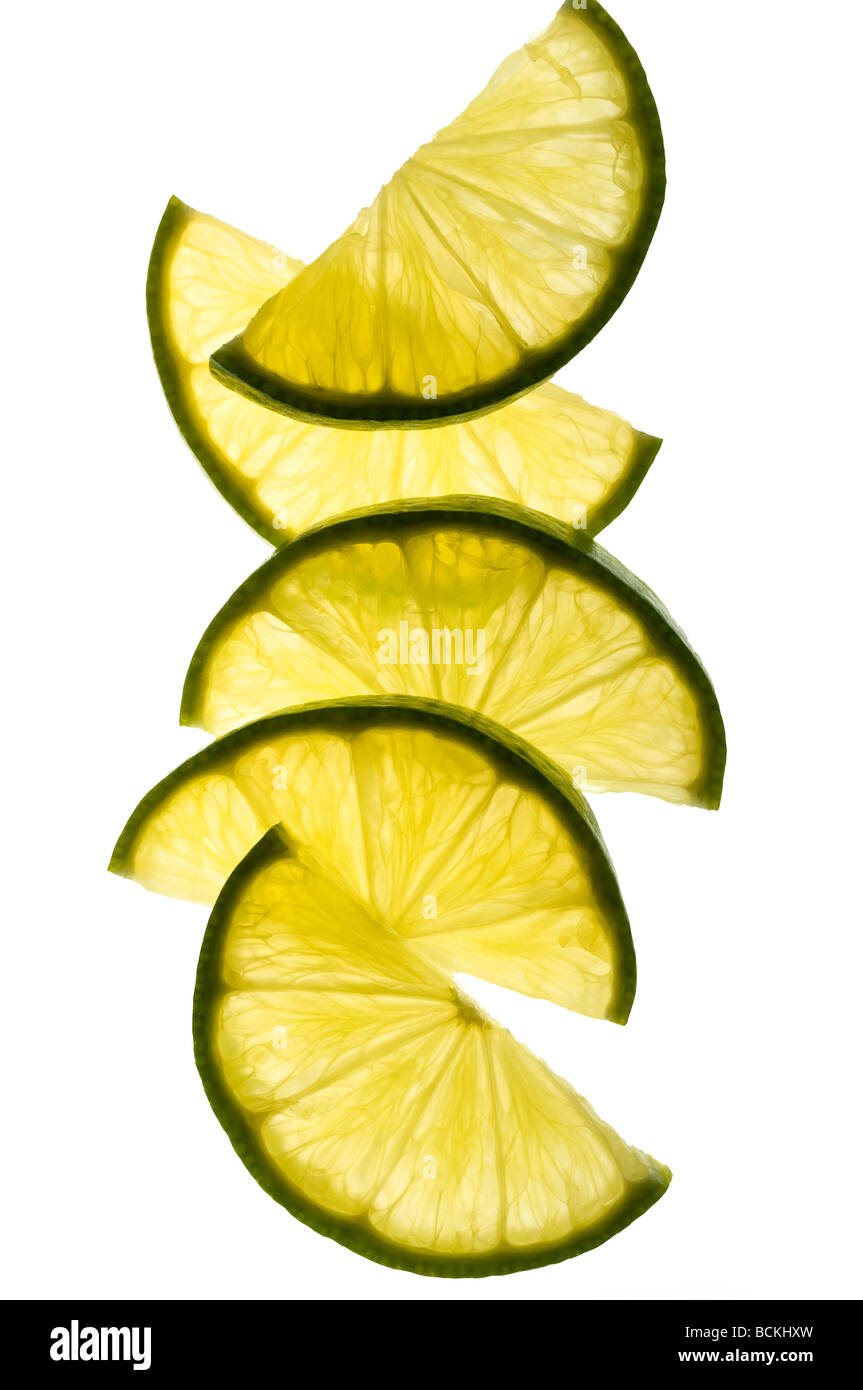Slices of lime on white background Stock Photo