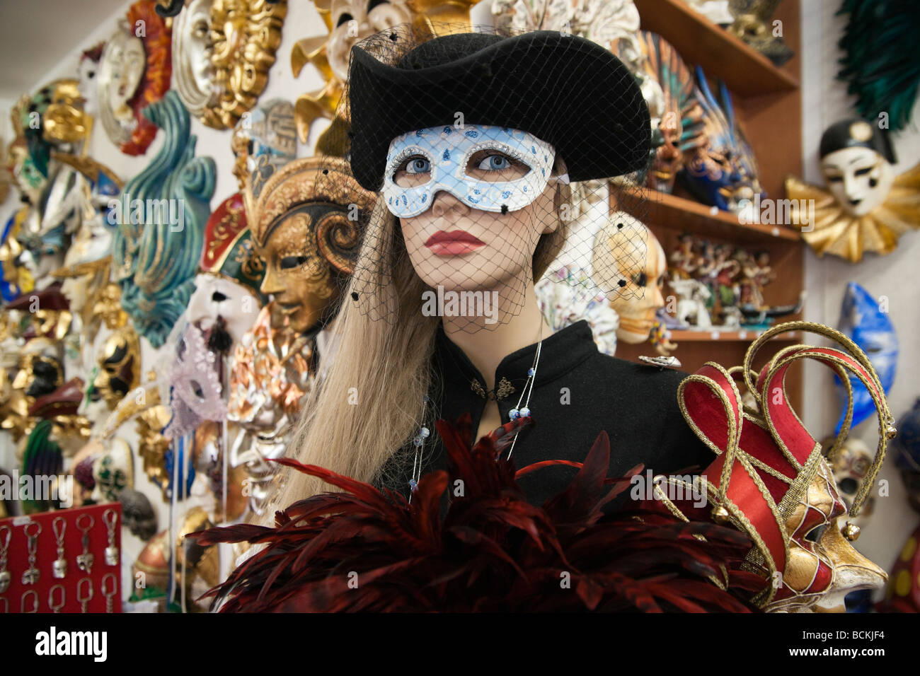 Venice souvenir carnival masks in shop with mannequin model Stock Photo