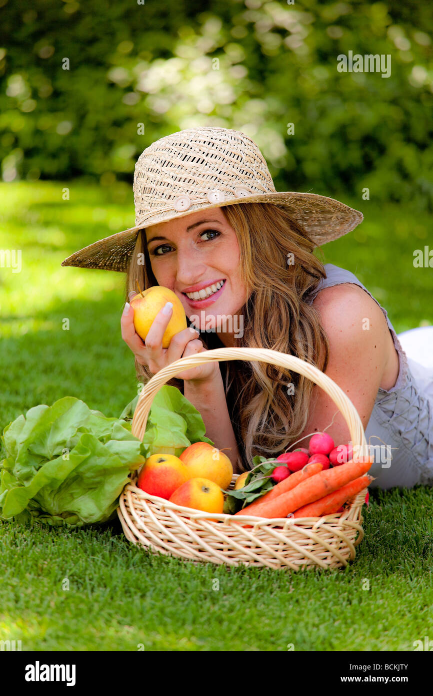 Fruit and vegetables in the basket with woman Stock Photo - Alamy