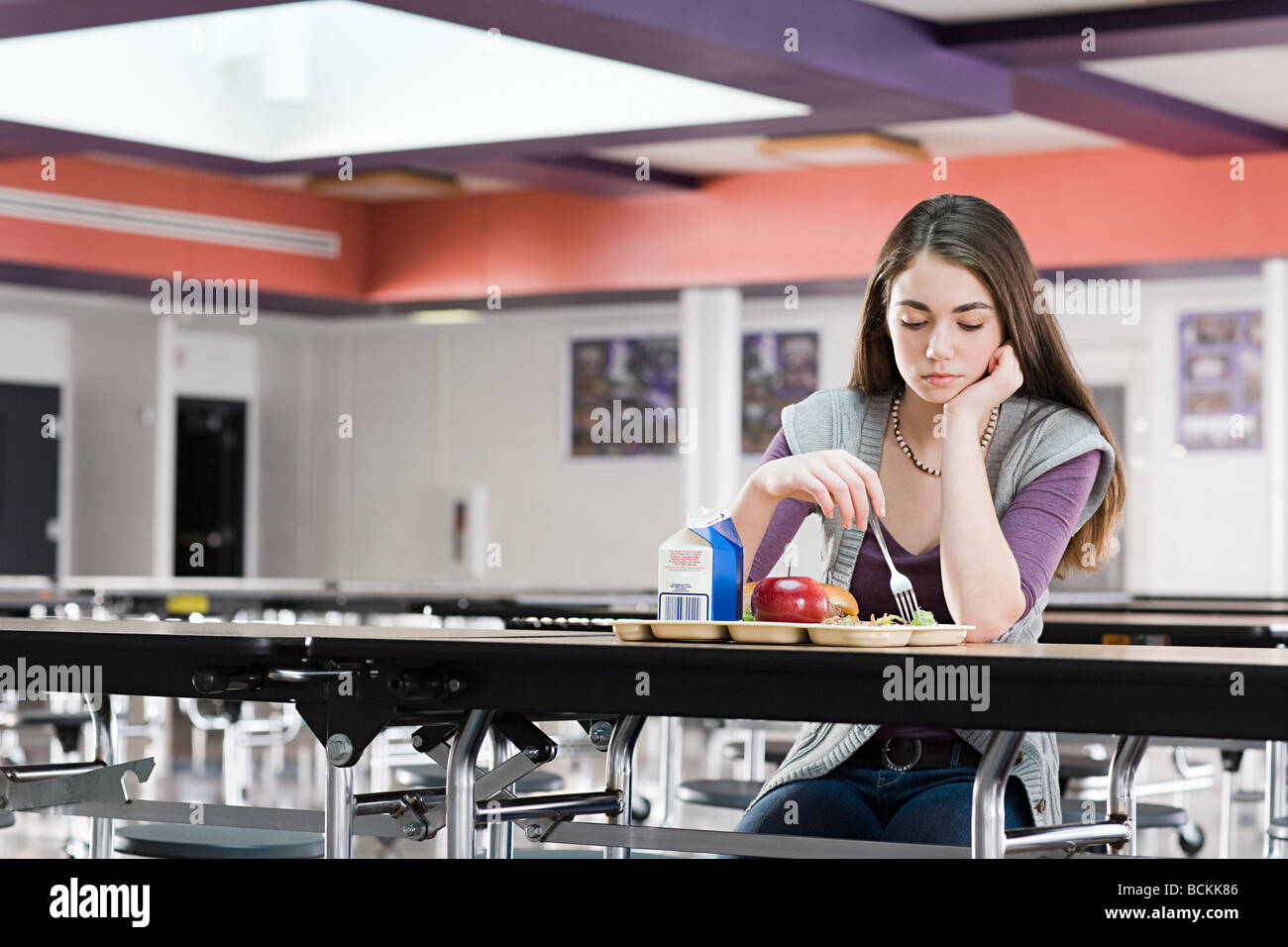 Girl alone at lunch Stock Photo Alamy
