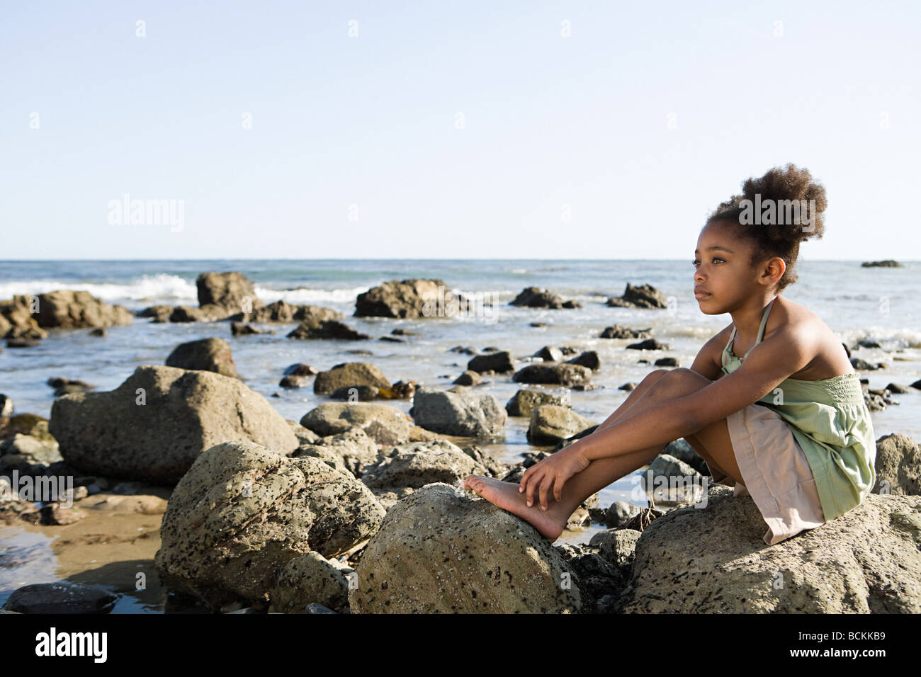Person sitting on rocks High Resolution Stock Photography and Images ...