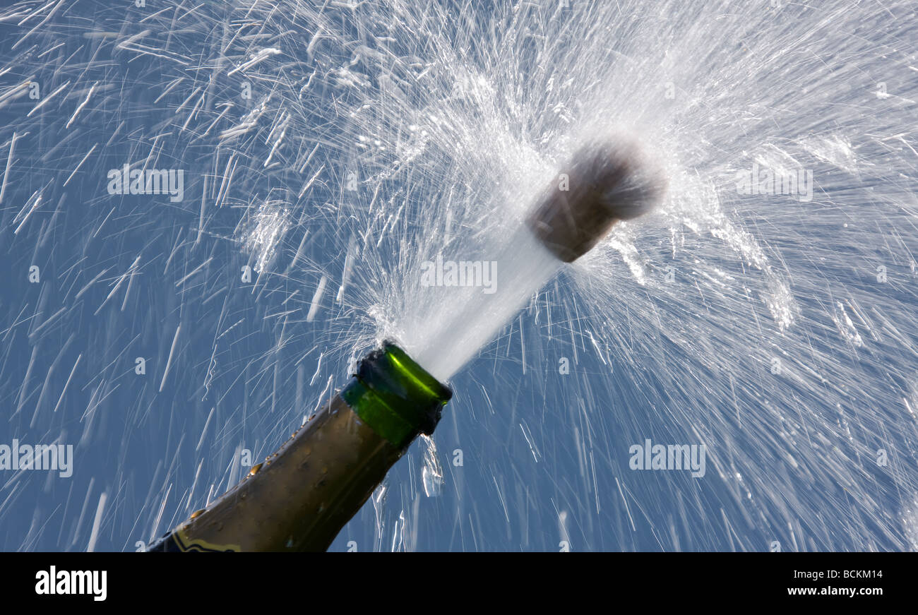 popping cork of an open champagne bottle Stock Photo Alamy