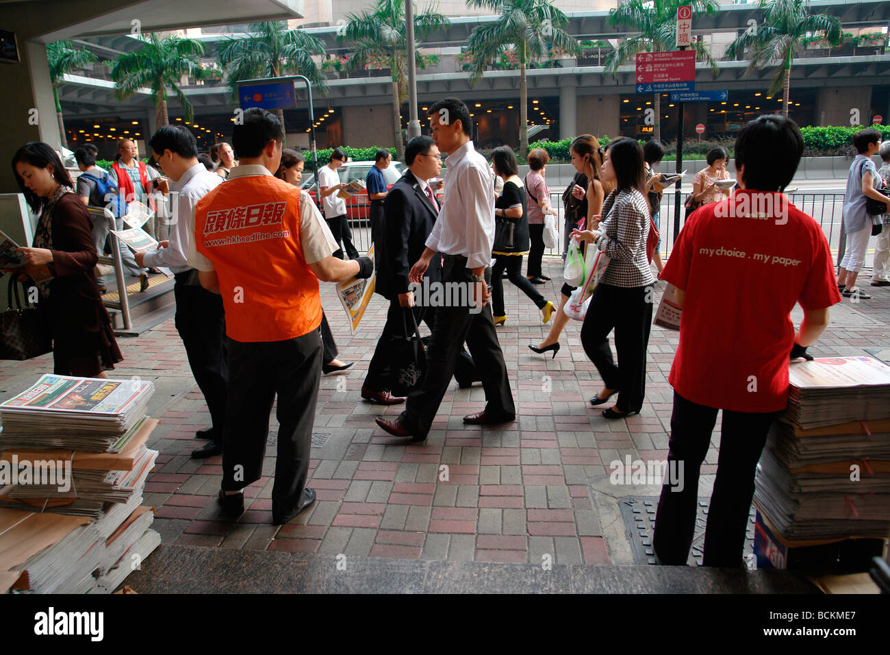 Hong Kong free newspaper distribution in central district to commuter Stock Photo