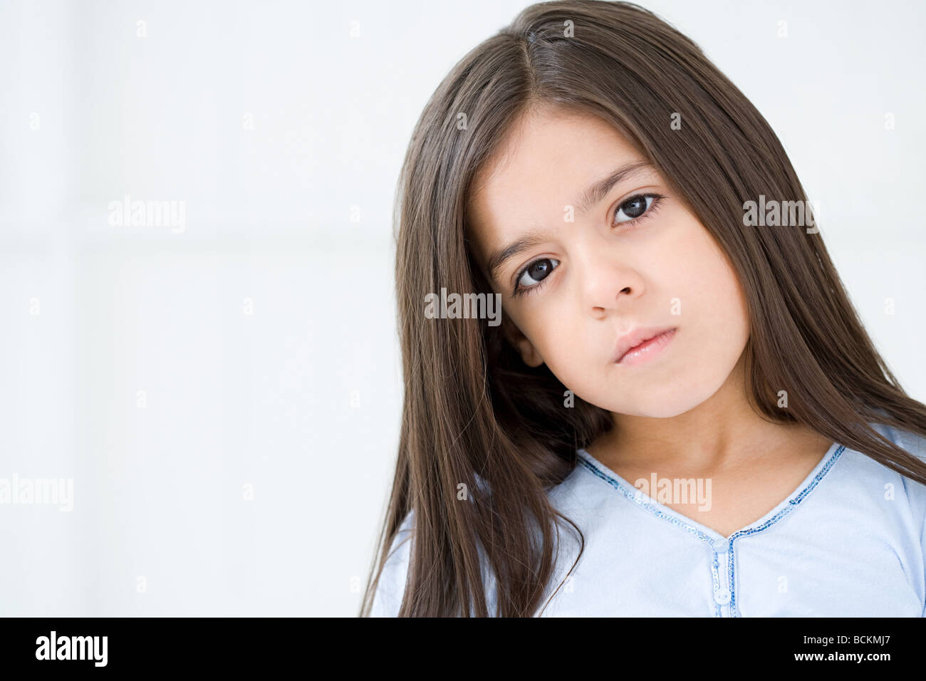 Serious looking hispanic girl Stock Photo - Alamy