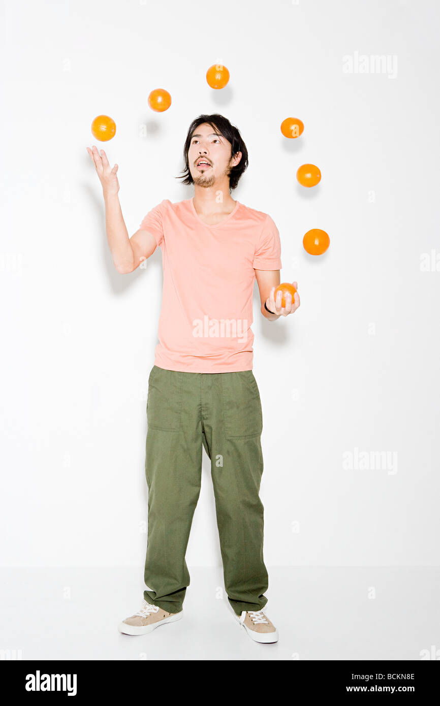 Man juggling oranges hires stock photography and images Alamy