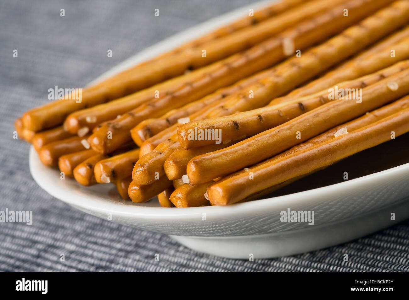 salt sticks on blue background Stock Photo