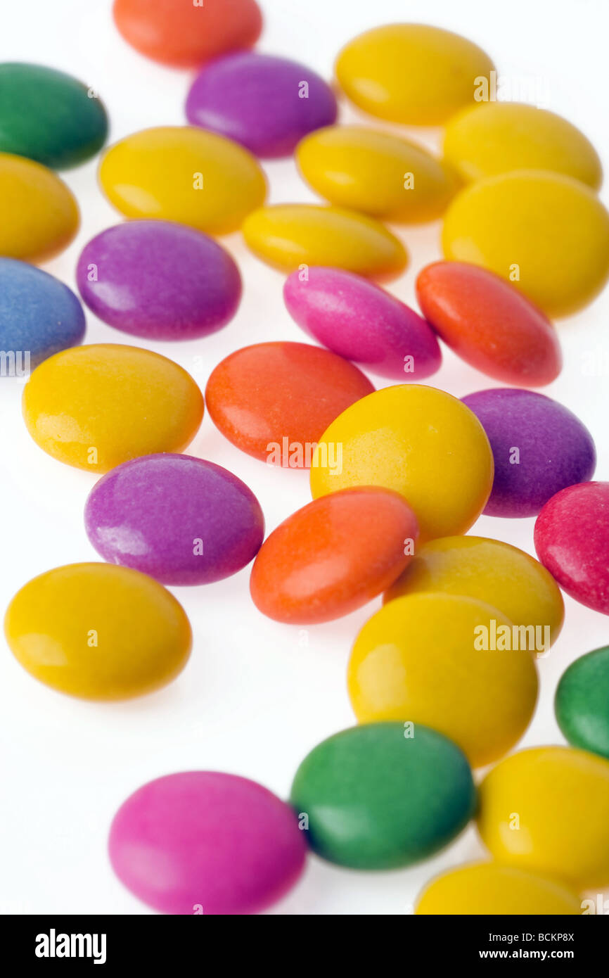 color bonbons on white background Stock Photo - Alamy