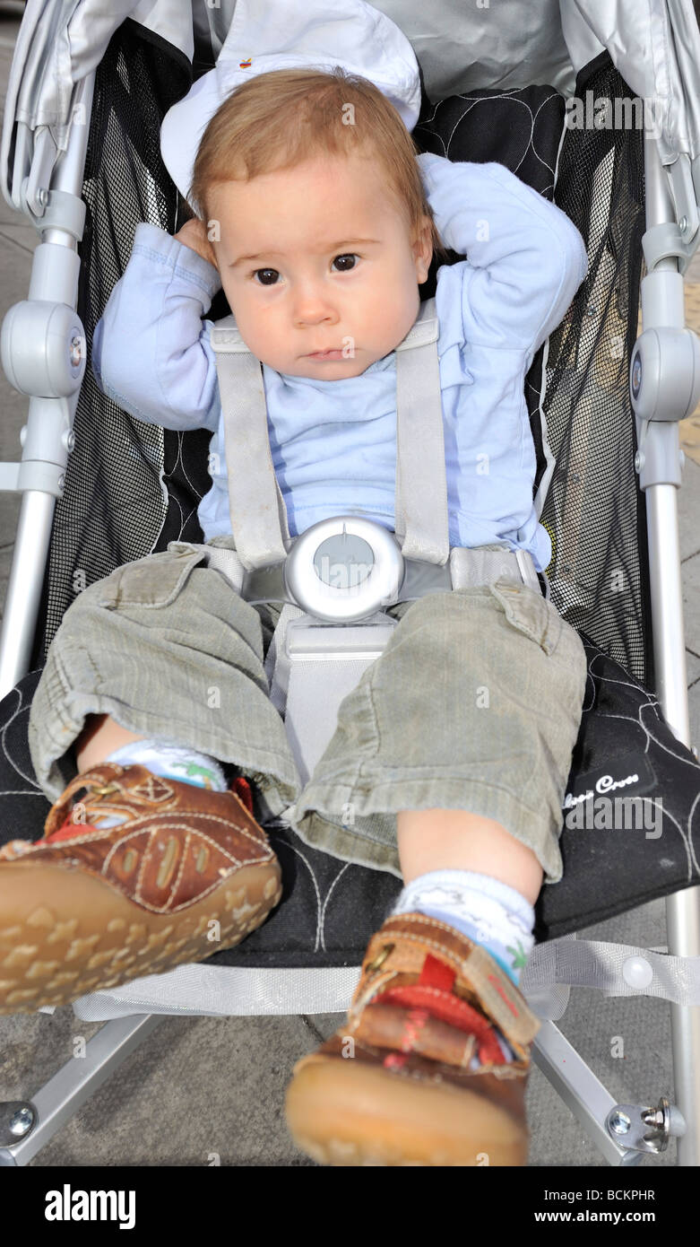 baby boy in pushchair Stock Photo Alamy
