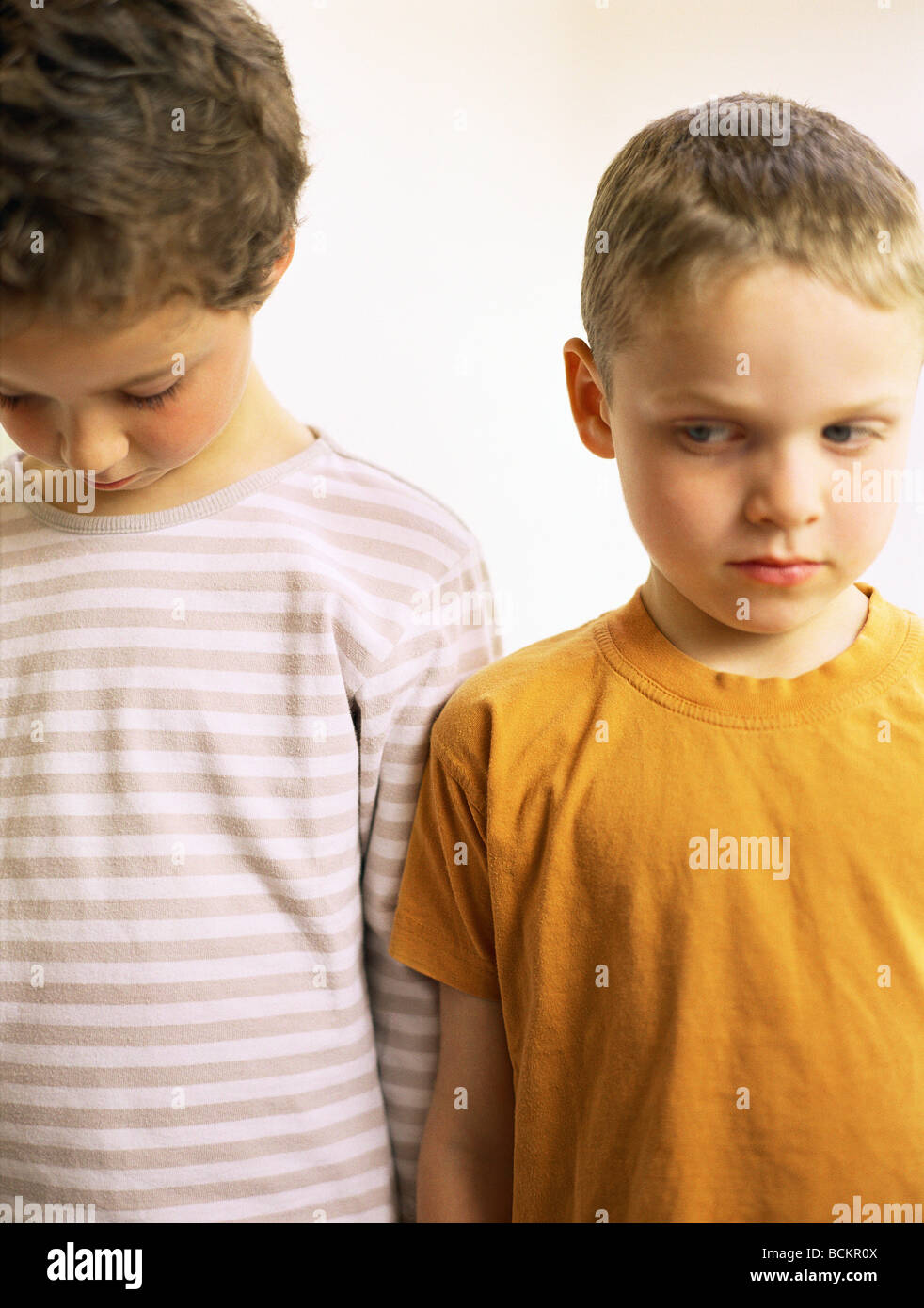 Two children standing side by side Stock Photo