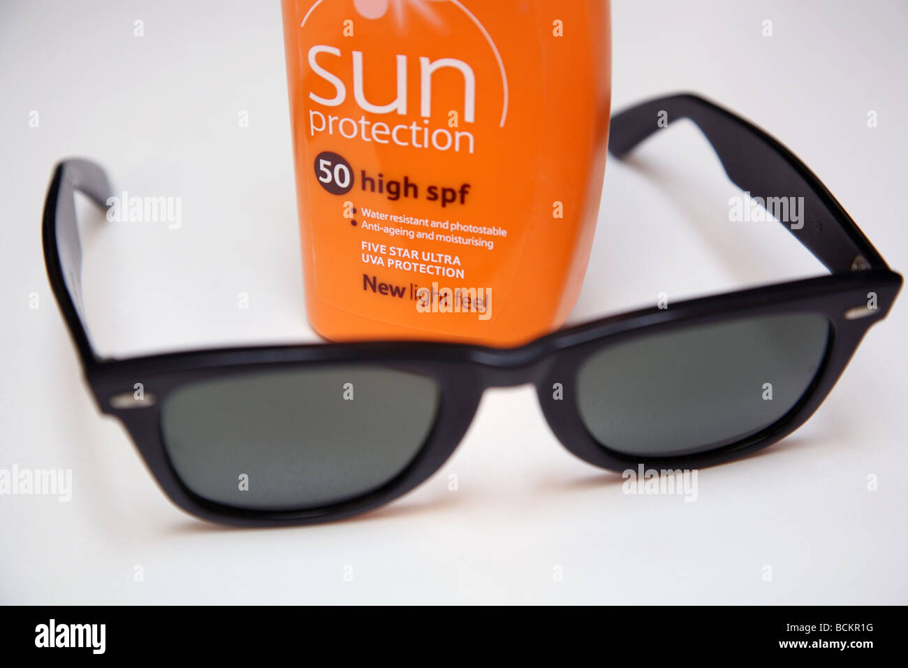 Hot weather precautions - sunblock, water, sunglasses Stock Photo