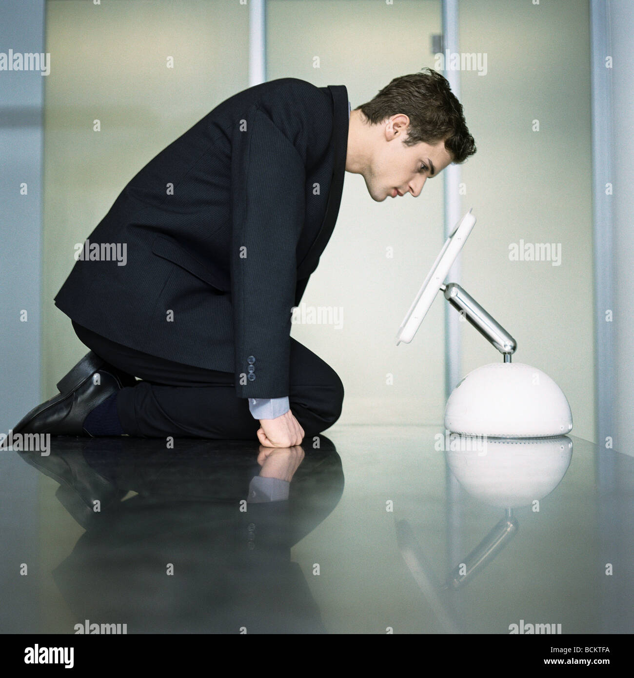 Man kneeling head down hi-res stock photography and images - Alamy