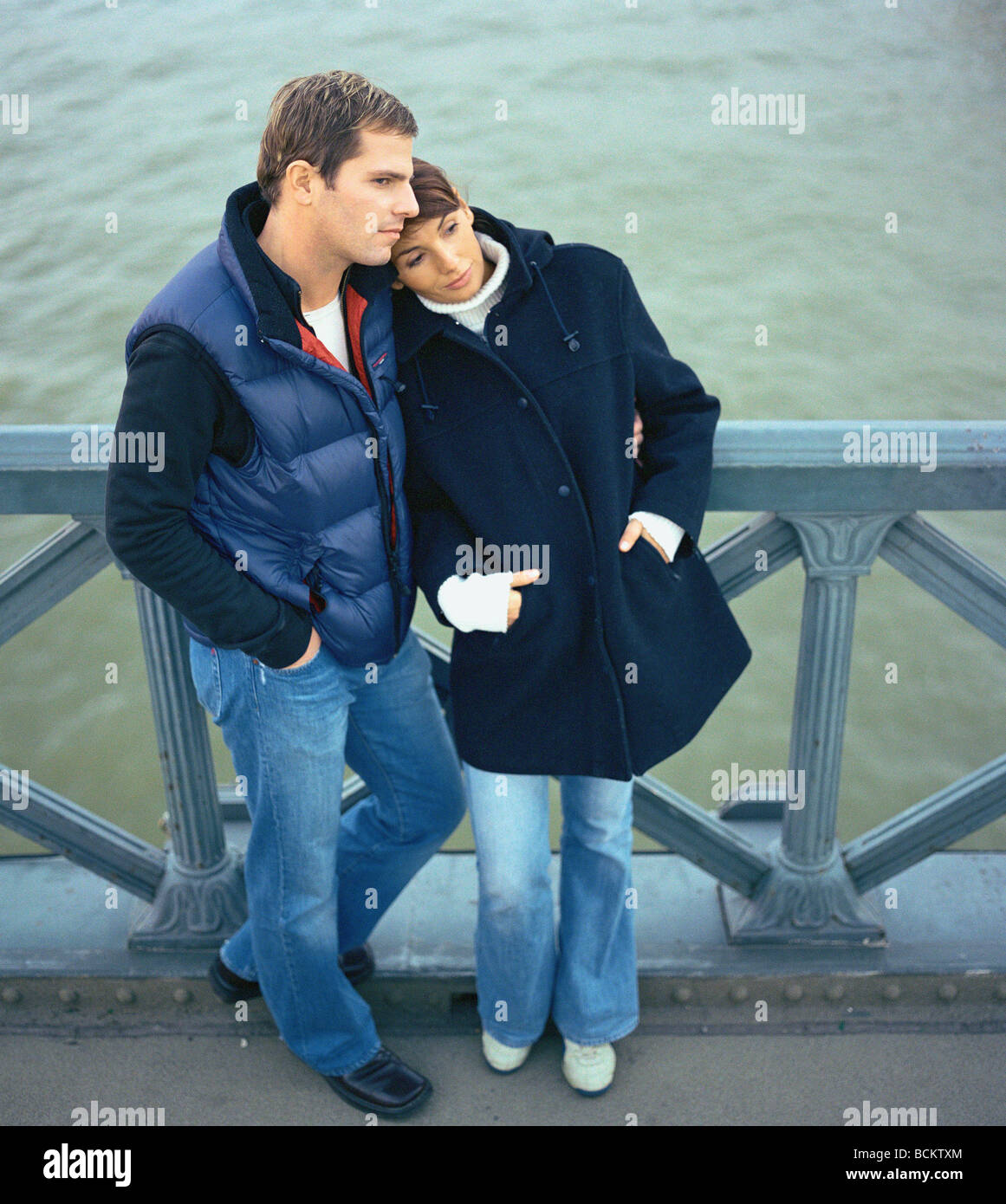 Man and woman standing together on bridge Stock Photo - Alamy