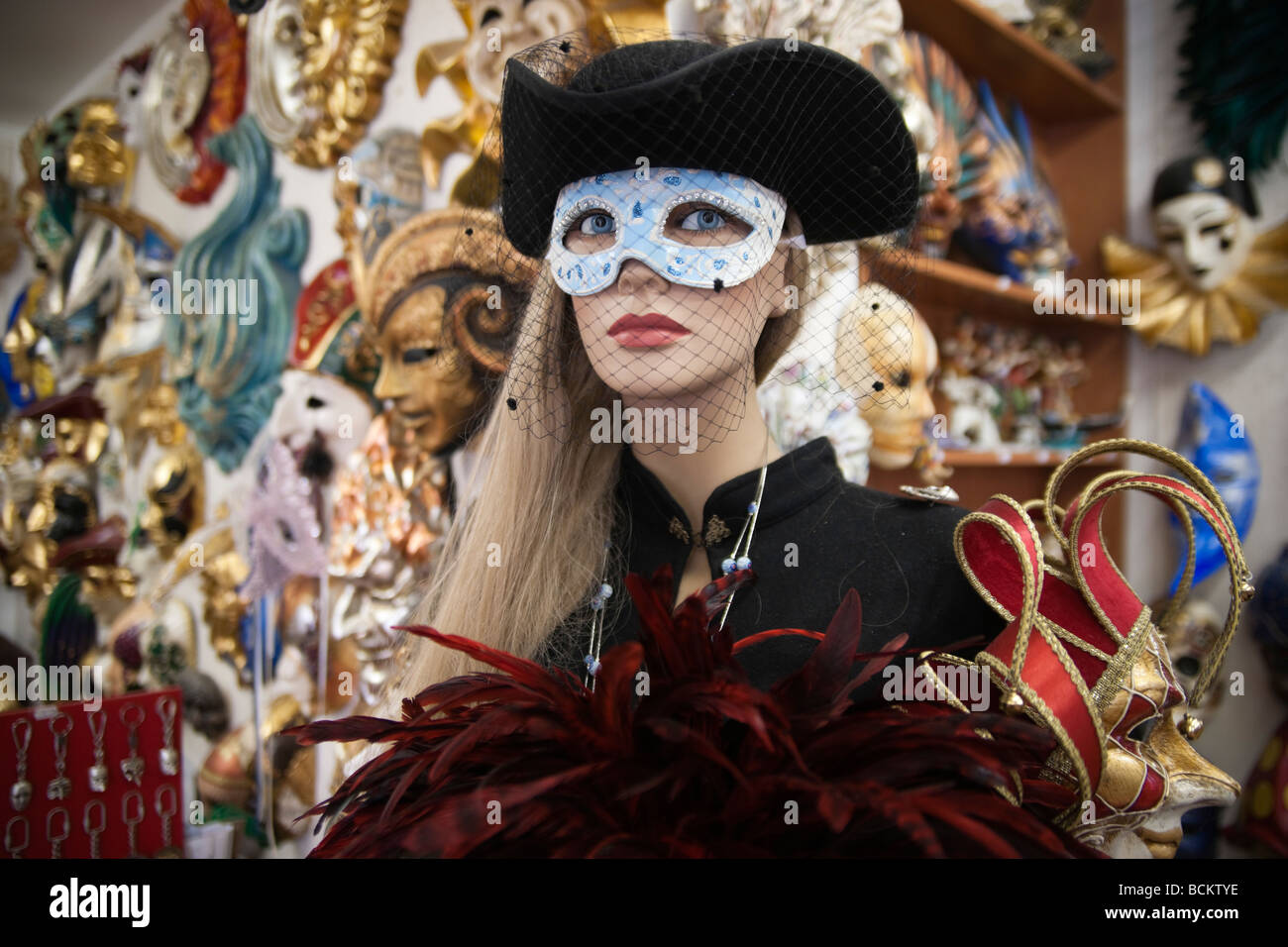 Venice souvenir carnival masks in shop with mannequin model Stock Photo