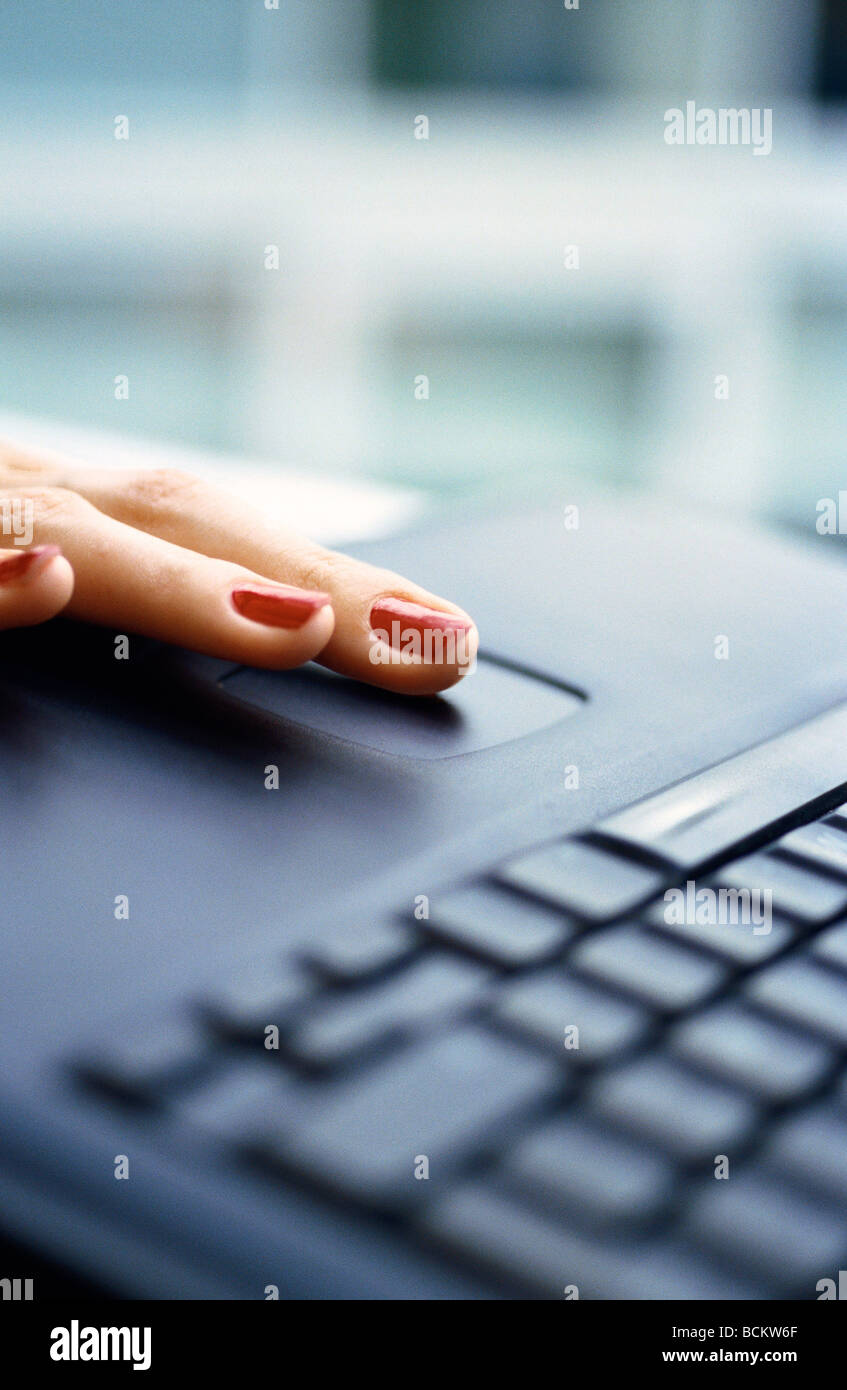 Woman's finger on laptop computer, close-up Stock Photo - Alamy