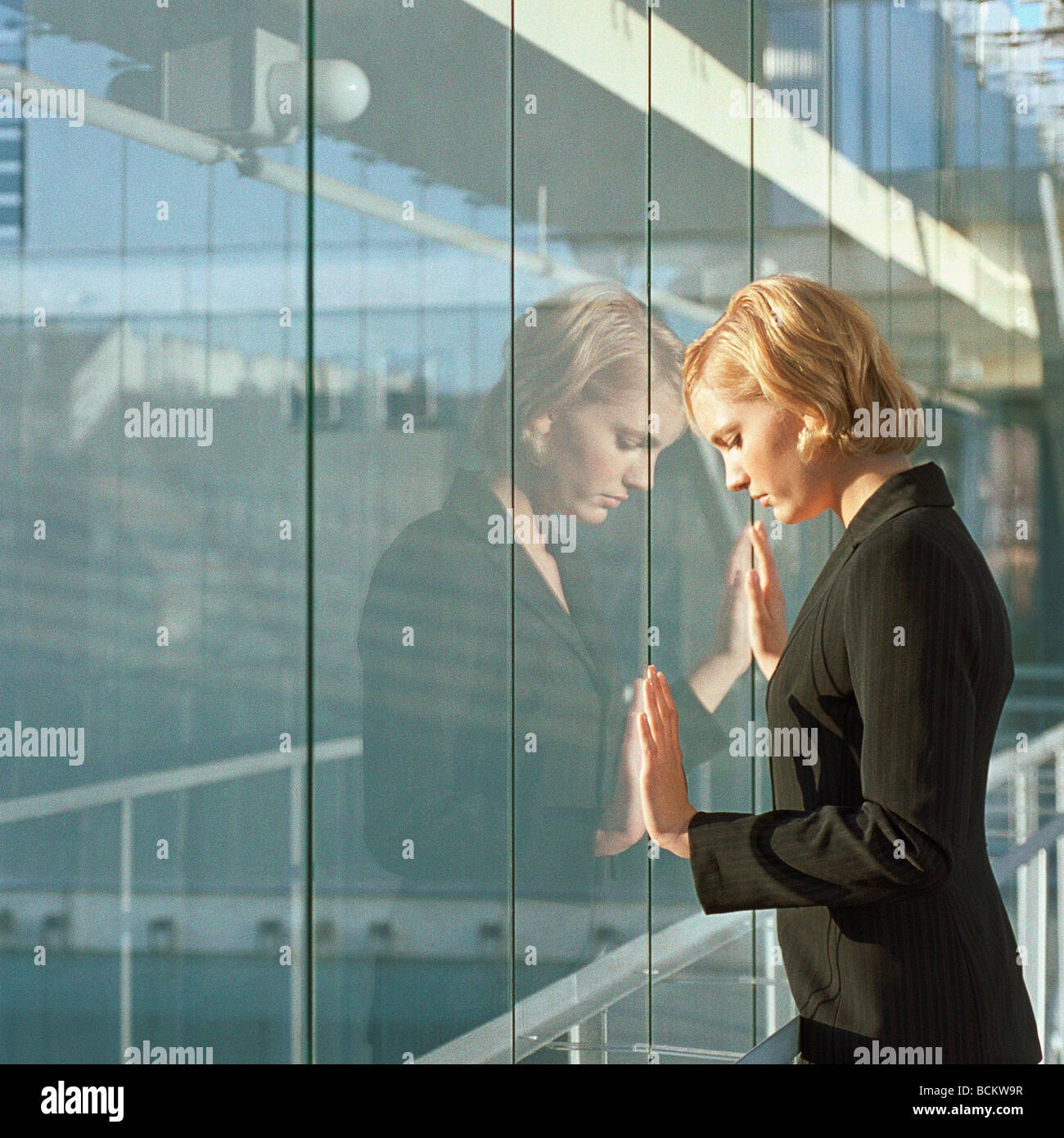 Young Woman With Hands Pressed Agains