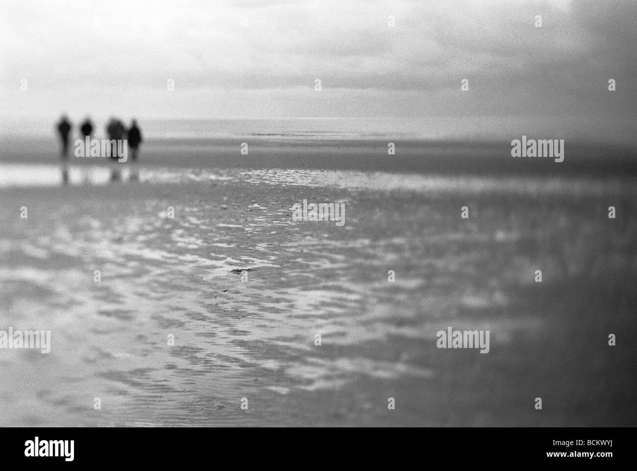 Couples on deserted beach Black and White Stock Photos & Images - Alamy