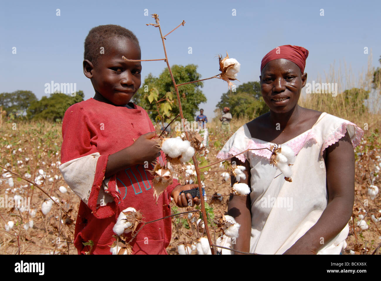 West Africa Burkina Faso , fairtrade and organic cotton project , portrait of woman and son at farm Stock Photo