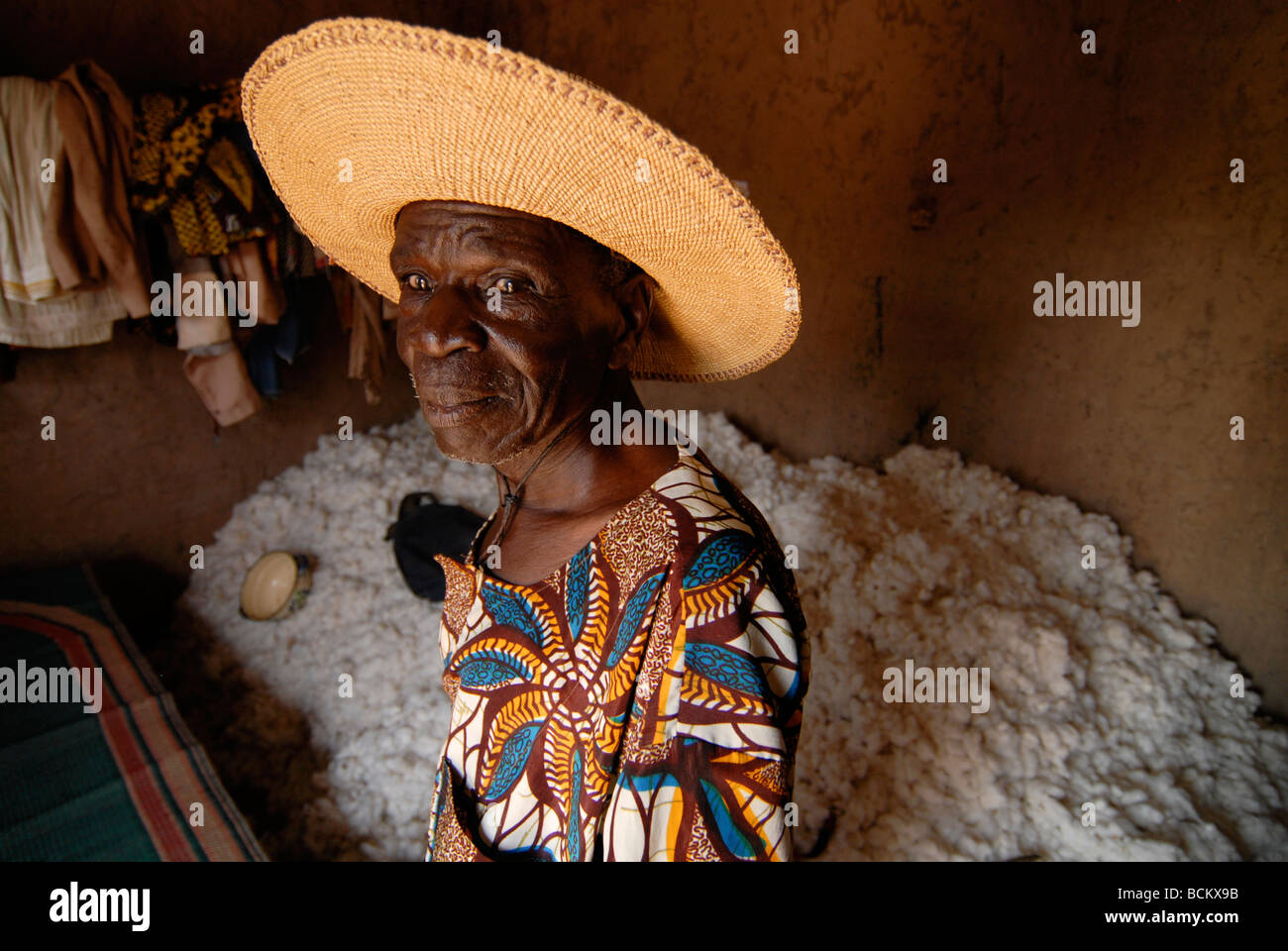 West Africa Burkina Faso , fairtrade and organic cotton project , cotton farmer with his store in his hut Stock Photo