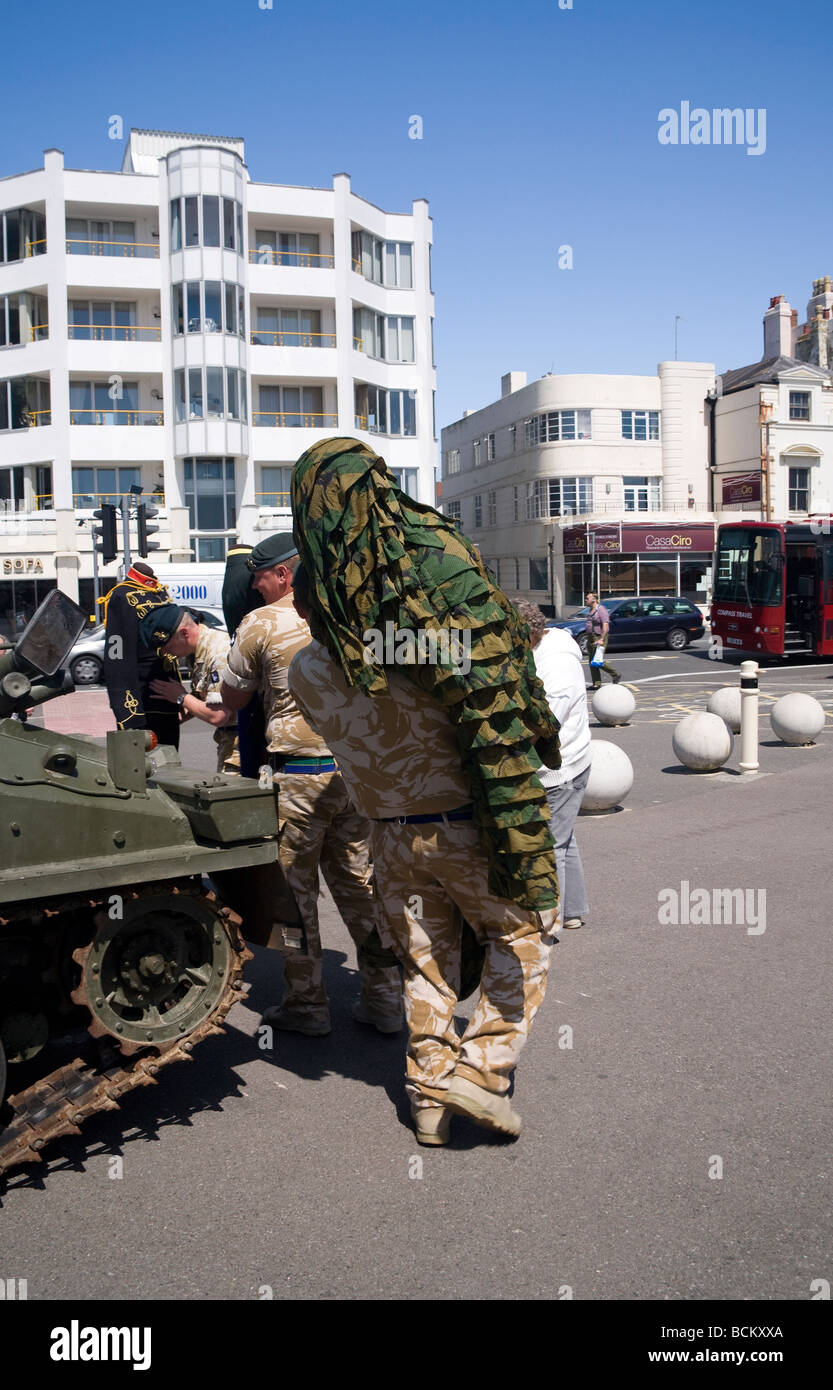 British soldier from Princess of Wales's Regiment carrying camouflage outfit. Worthing, West Sussex, UK Stock Photo