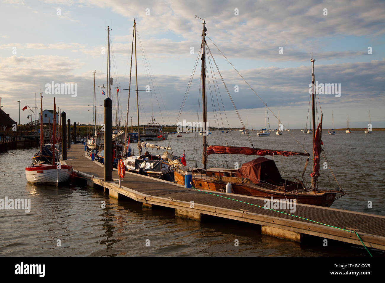 Wells next the sea harbour in Norfolk england in evening sunlight Stock Photo