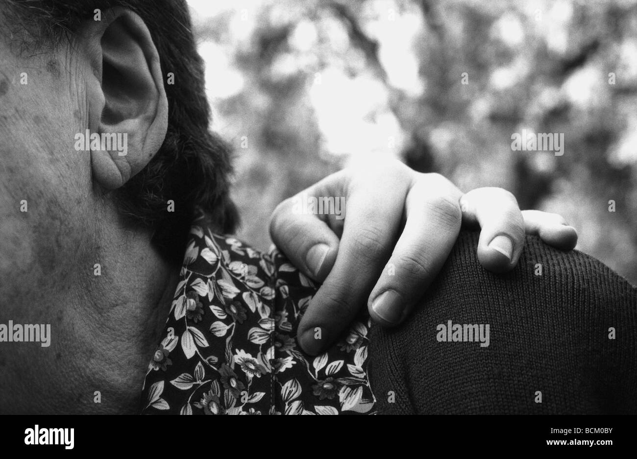 Hand shoulder face Black and White Stock Photos & Images - Alamy