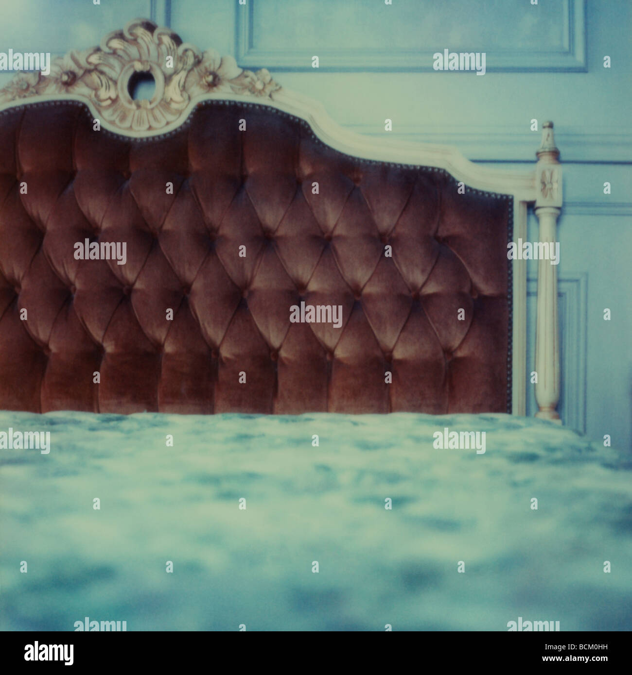Bed with velour headboard Stock Photo
